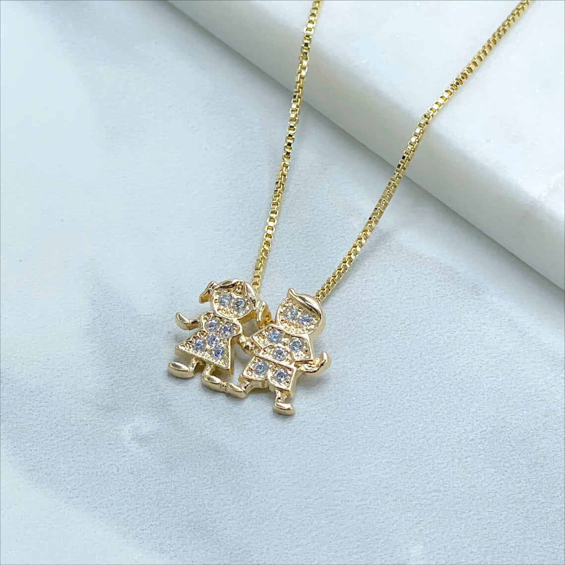 Chain and Pendant Set. Box Link Chain with Boy and Girl Pendant in Cubic Zirconia 18k Gold Filled. Bundle and Save. FREE SHIPPING on orders of $100 and over.  Sam's Jewelry World USA.