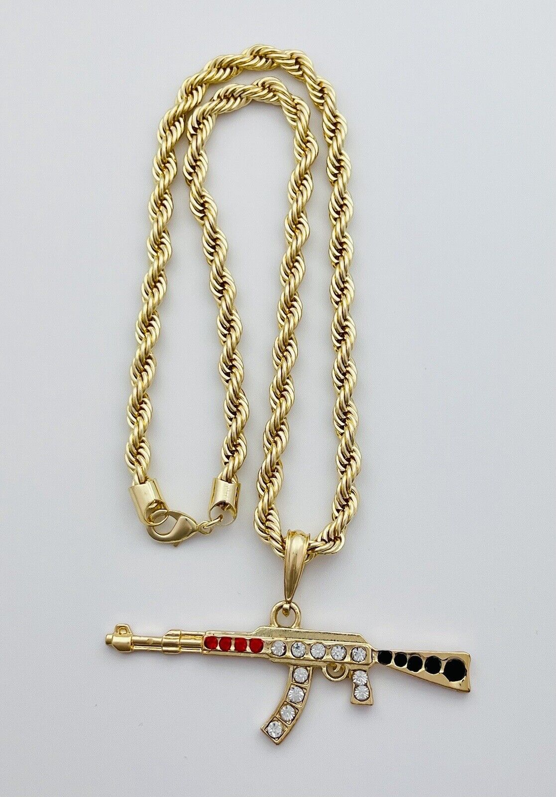 Chain and Pendant Set. Firearm and 6mm Rope Chain Set 18k Gold Filled. Bundle and Save. FREE SHIPPING on orders of $100 and over.  Sam's Jewelry World USA.