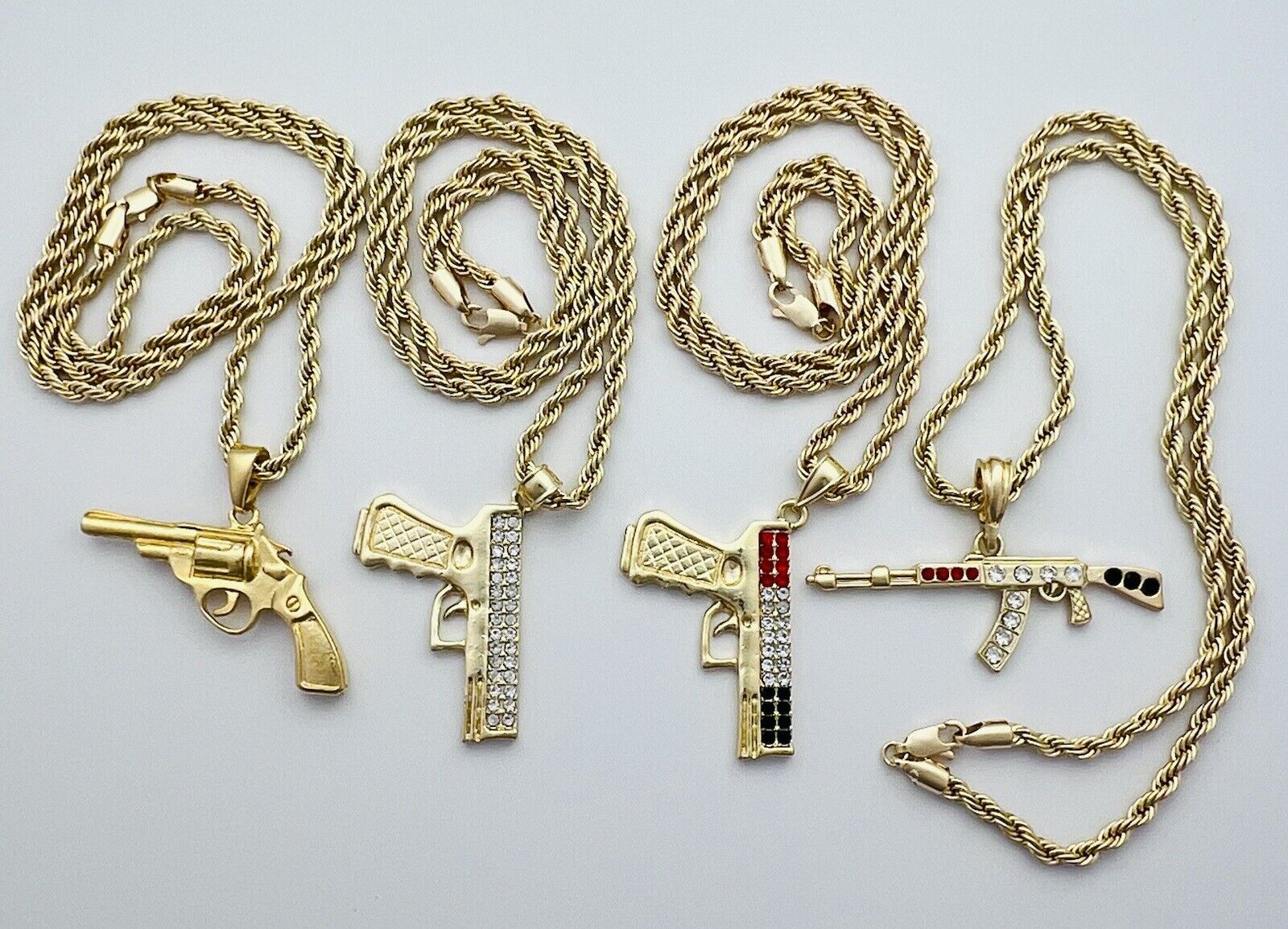 Chain and Pendant Set. Firearm and 4mm Rope Chain Set 18k Gold Filled. Bundle and Save. FREE SHIPPING on orders of $100 and over.  Sam's Jewelry World USA.