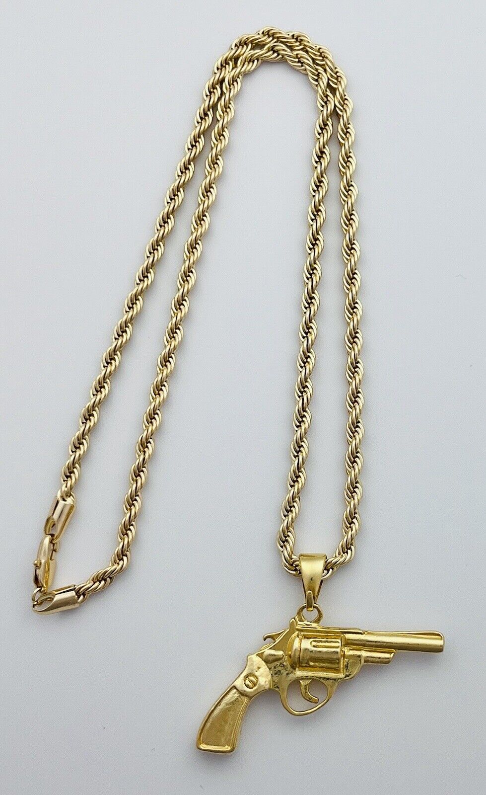 Chain and Pendant Set. Firearm and 4mm Rope Chain Set 18k Gold Filled. Bundle and Save. FREE SHIPPING on orders of $100 and over.  Sam's Jewelry World USA.