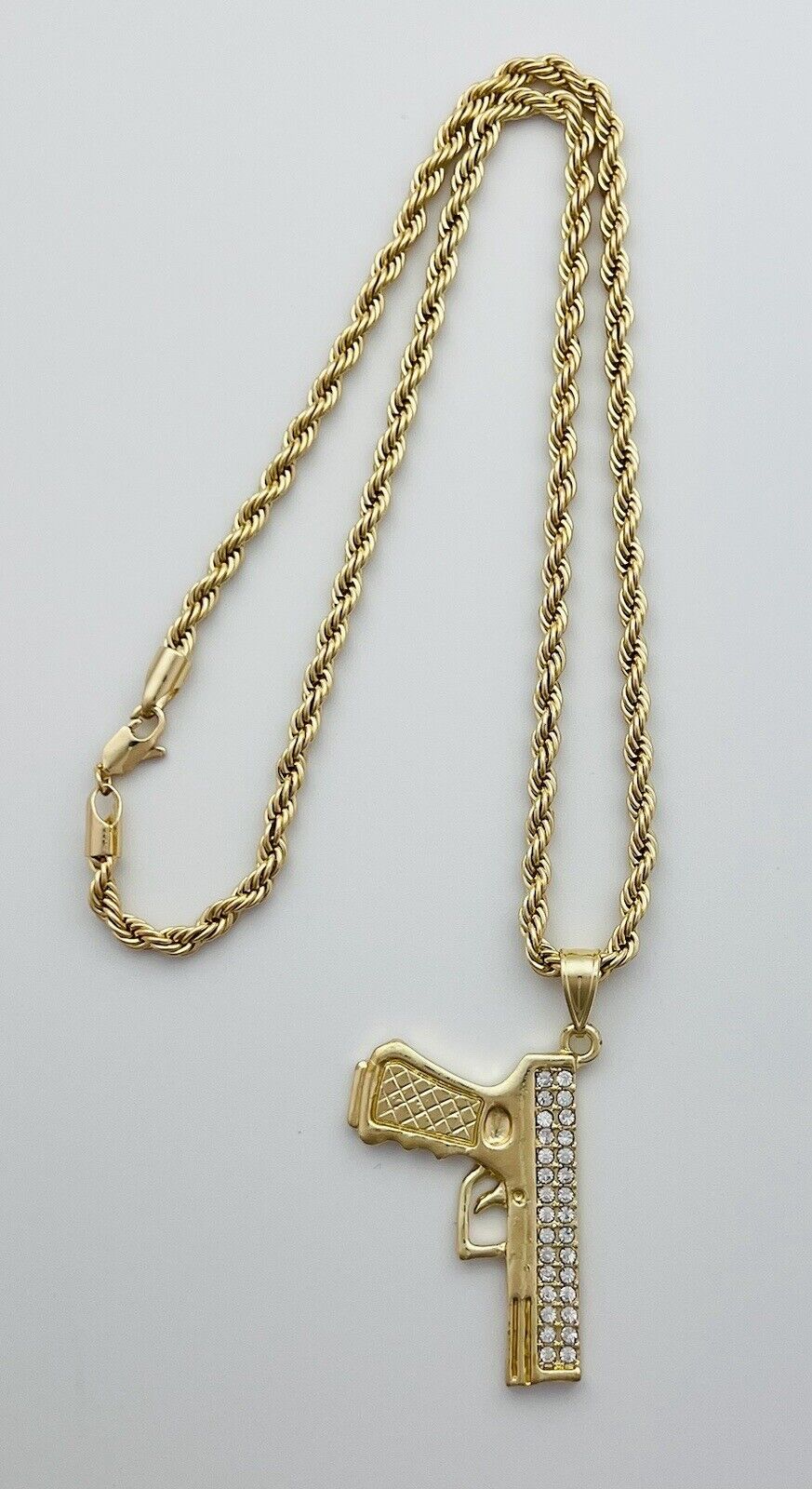 Chain and Pendant Set. Firearm and 4mm Rope Chain Set 18k Gold Filled. Bundle and Save. FREE SHIPPING on orders of $100 and over.  Sam's Jewelry World USA.