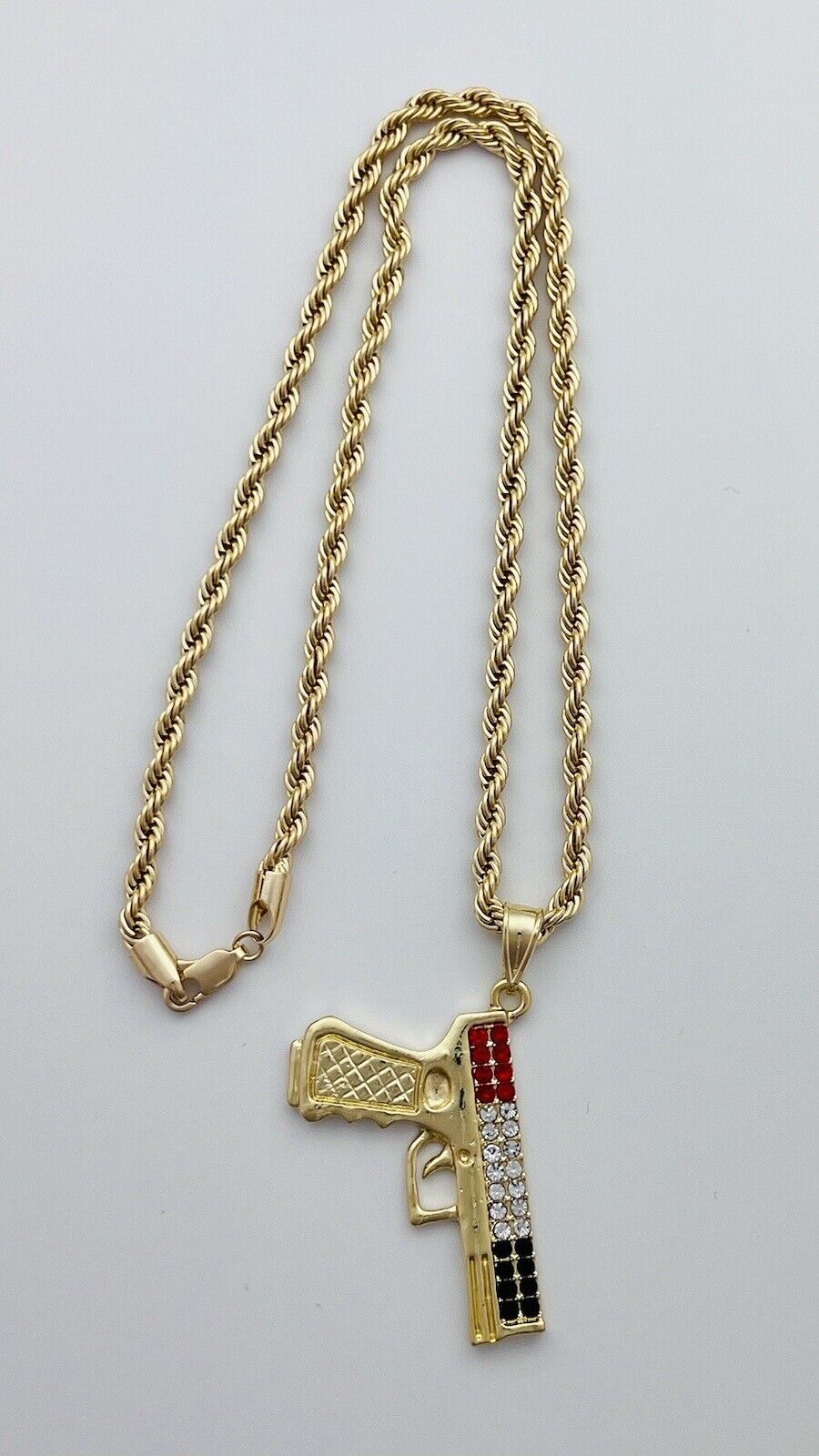 Chain and Pendant Set. Firearm and 4mm Rope Chain Set 18k Gold Filled. Bundle and Save. FREE SHIPPING on orders of $100 and over.  Sam's Jewelry World USA.