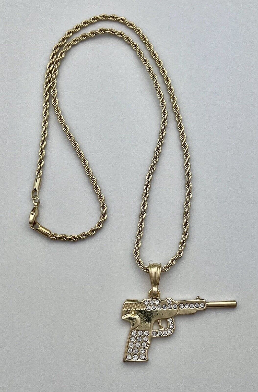 Chain and Pendant Set. Firearm and 2mm Rope Chain Set 18k Gold Filled. Bundle and Save. FREE SHIPPING on orders of $100 and over.  Sam's Jewelry World USA.