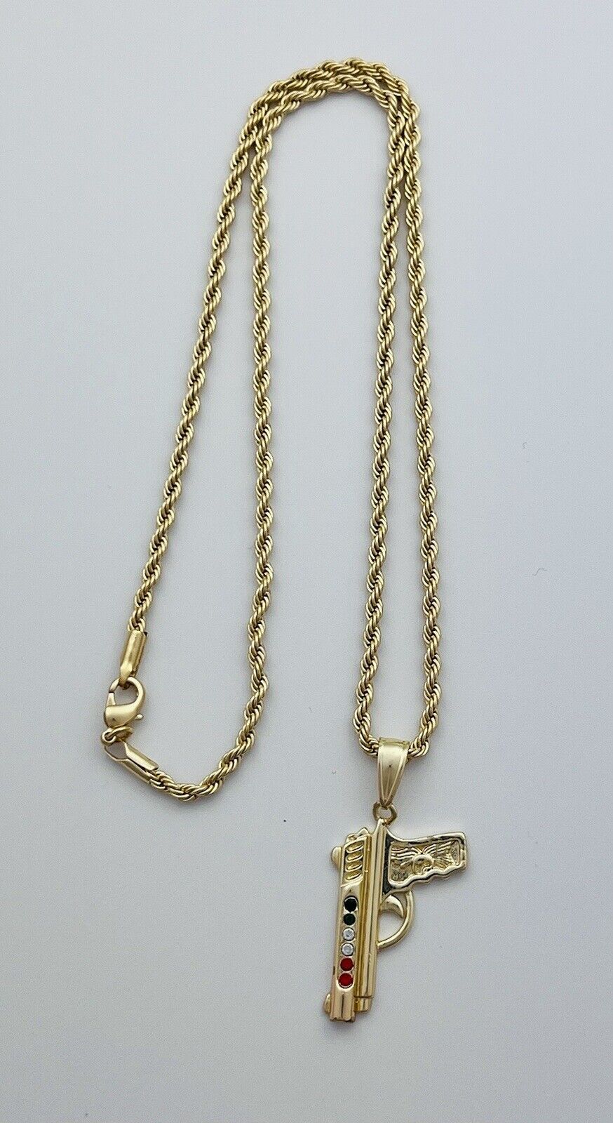 Chain and Pendant Set. Firearm and 2mm Rope Chain Set 18k Gold Filled. Bundle and Save. FREE SHIPPING on orders of $100 and over.  Sam's Jewelry World USA.